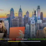 Modern Philadelphia skyline with digital icons and developers collaborating, representing e-commerce growth.